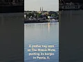 A pusher tug seen on The Illinois River pushing its barges in Peoria Il