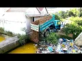 Lagu Start New Project Pushing Rock to the deep pot , garbage , forest and water by Truck and bulldozer