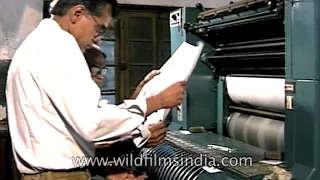 indian men work at a printing press in olden days
