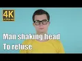 Man shaking head to refuse blue background