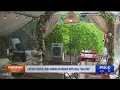 Latino couple living American Dream with nail saloon