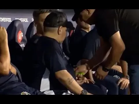 Download MP3 😱 Maradona appears to use 'drugs' on bench with staff trying to cover cameras