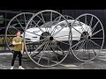 Driving A Tesla Upside-Down 10ft Tall Wheels
