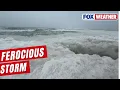 Giant Waves Of Ice Crash Along Lake Michigan Shore During Life-Threatening Blizzard