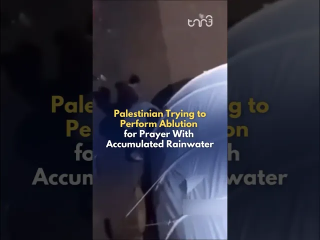 ⁣A Palestinian Muslim man performs ablution with accumulated rain water from the top of the tent.