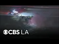 Fire burns under 110 Freeway in San Pedro