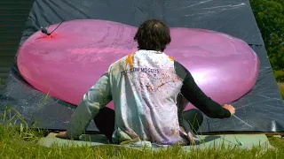taking an 8ft giant water balloon to the chops the slow mo guys