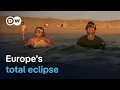 Millions watch as rare solar eclipse darkens Spain and Iceland DW News