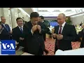 Download Lagu Russia's Putin and China's Xi Jinping learn to make Chinese dumplings | VOANews