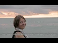 Pretty girl smiles at sunset by the sea - Georgia