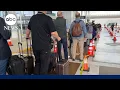 Record-long wait times stretch TSA officers amid travel surge partial shutdown