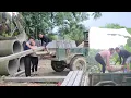Download Lagu Ms. Dam helps Mr. Vang prepare materials to build a new house.
