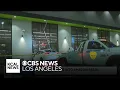 shows moments car drives through window of Los Angeles Amazon Fresh store