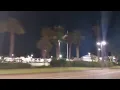 uptown station flag flying at night in Fort Walton Beach FL