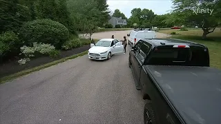 Driver Backs Into Van in the Driveway