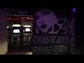 Inside black light bar and Detroit-themed arcade at Deluxx Fluxx