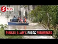 Major roads in Puncak Alam submerged, stranding motorists