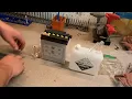 How to prepare a new motorcycle battery with acid
