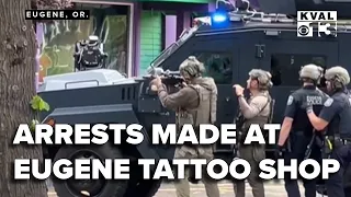 Police identify two suspects arrested in warrant search at tattoo shop