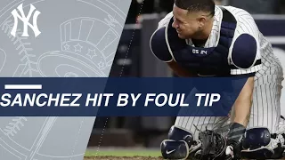 AL WC Sanchez hit hard on foul tip stays in game