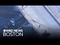Truck plummets off Boston overpass after colliding with car
