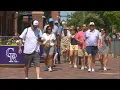 Rockies fans flee Coors Field in scorching heat