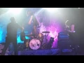 Carrie Brownstein jumps off a drumkit