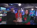 Angie surprises Marina and Joe with a cake to celebrate DMV Zone