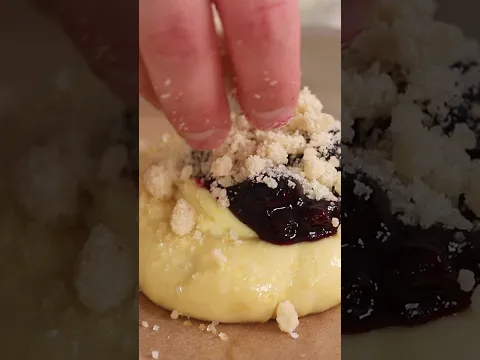 Swirled sweet buns filled with cream cheese and blueberries, baked to a golden brown by Sugar Spun Run