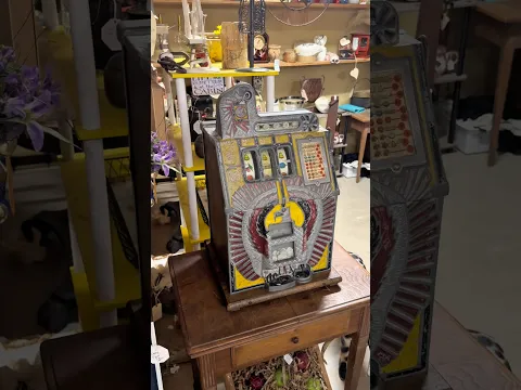 A slot machine with only 5 cents minimum bet! What a beautiful machine I wonder how old it is.