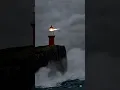 Download Lagu The lighthouse beam cuts through thick storm fog.