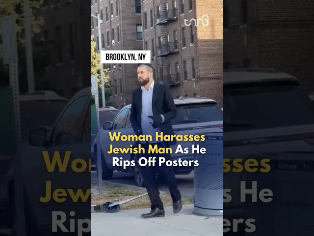 ⁣Jewish man rips off posters of Israeli Hostages in New York, unbothered by the woman harassing him.