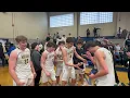 Montville boys basketball celebrates with the N1G3 sectional trophy after defeating Teaneck on