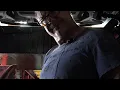 Working the pit at an oil change shop