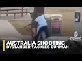 Video shows bystander tackling and disarming one of the shooters at Sydney’s Bondi Beach