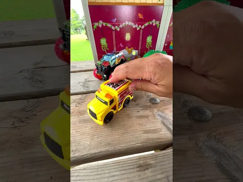 Fun Toy Trucks and Farm Barn Setup on a Wooden Picnic Table