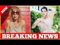 American Pickers Danielle Colby shows off tattoos in low-cut dress sticks out tongue at camera