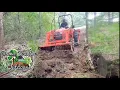Kubota L2501 clearing land and pulling trees out