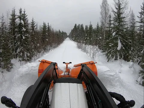FMG IVALO snow plough opening forest road in deep snow