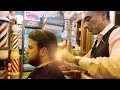 The most soundful scissors for the whole haircut and a beard trim at NYC Barber Shop Museum