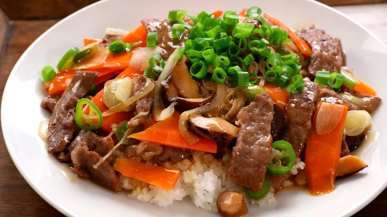 Beef and mushrooms stir-fried over rice (Soegogi-beoseot-deopbap: )