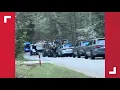 Armed suspect in custody after firing shots at multiple people homes in Newton County