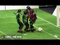 Chinese AI robots compete in first ever soccer match