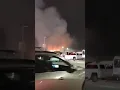 A grass fire breaks out outside Arrowhead Stadium