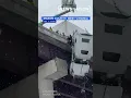Watch Man rescued from semitrailer hanging over bridge