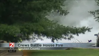 Multiple fire departments tending to house fire in Steuben County