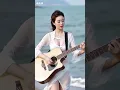 Download Lagu viral cewek cantik dan anggun main gitar akustik di pantai rusia#music #shorts #viral