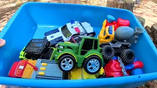 Toy Vehicles on Forest Logs: Police Car, Fire Truck, Tractor & More