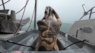 ICE COLD BATH IN THE RAIN (new use of our recycled dinghy)