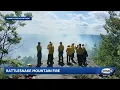 Crews continue to battle fire on Rattlesnake Mountain